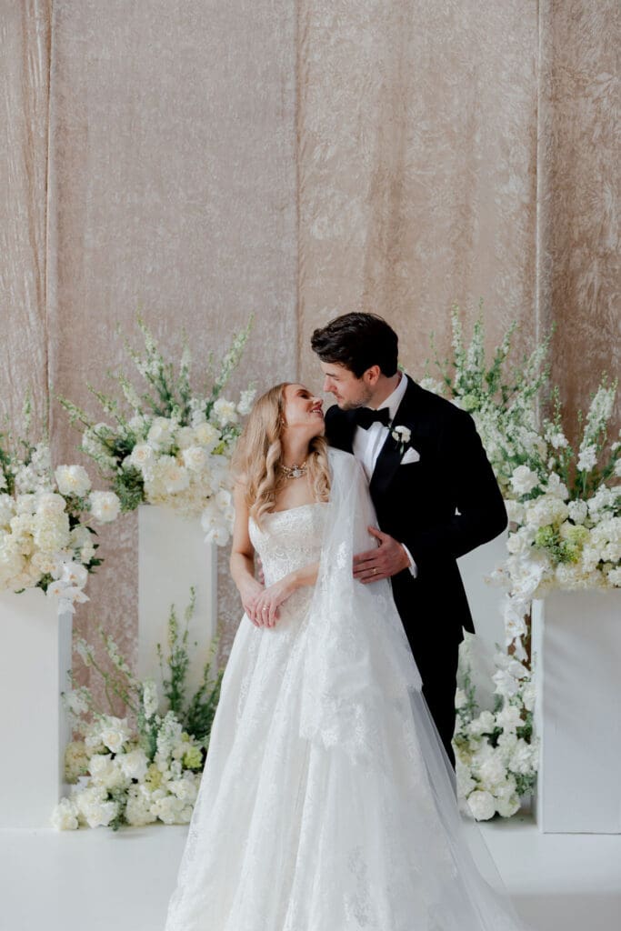 cute picture of the bride and groom smiling at each other