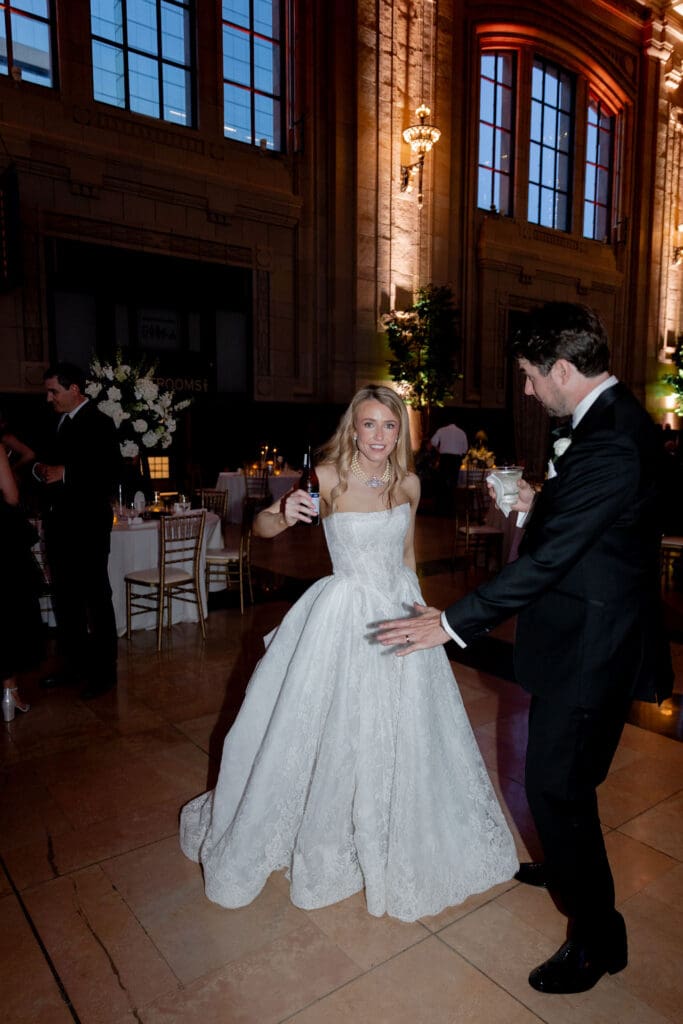 newlyweds having the best time at their wedding reception