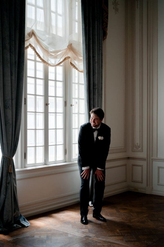 groom emotional seeing the bride in her wedding dress