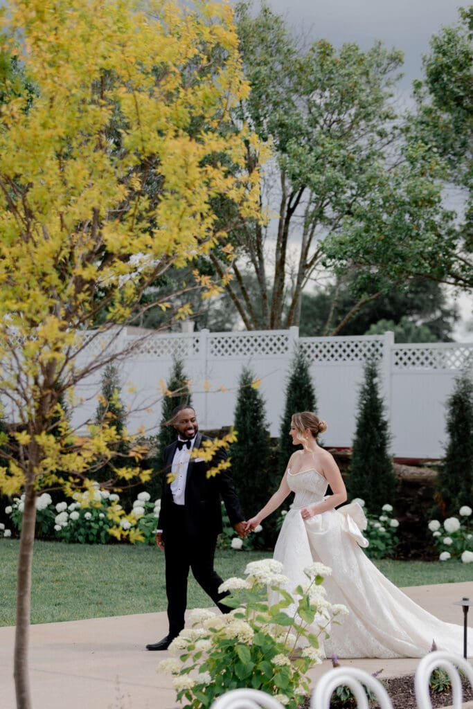 beautiful picture of the newlyweds holding hands