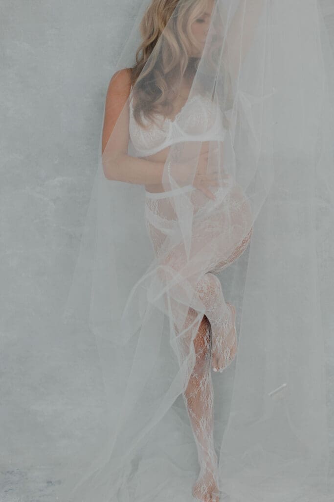 romantic boudoir session in a studio