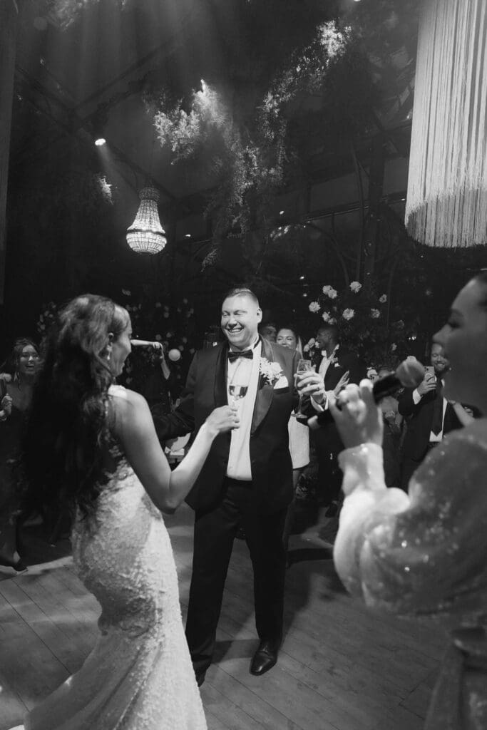 newlyweds having the best time at their dream wedding reception after party