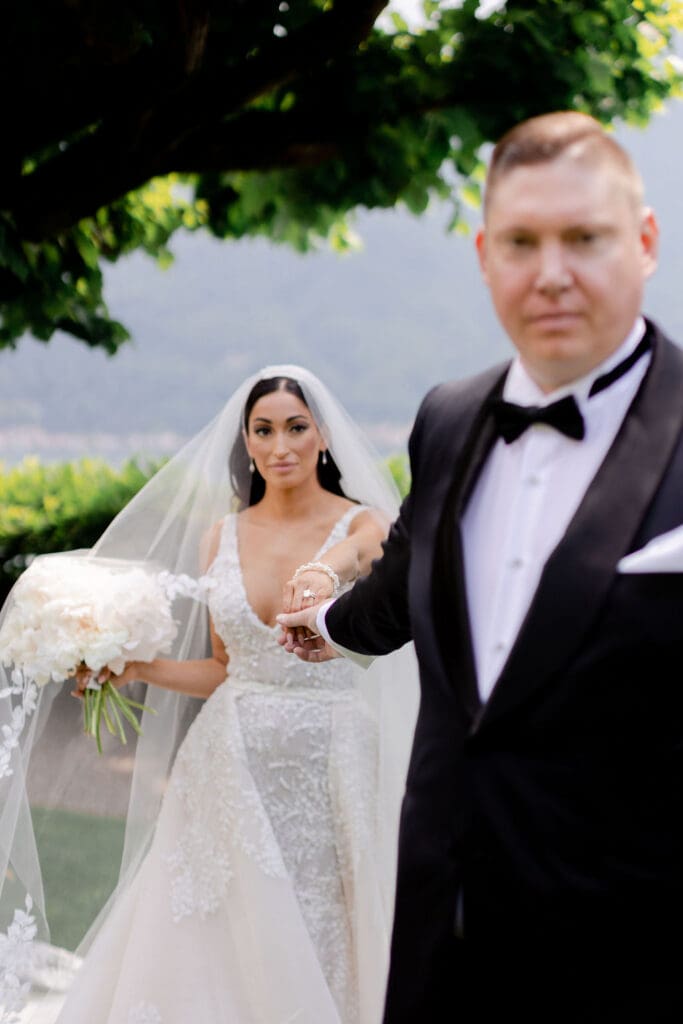 cute picture of the bride and groom holding hands